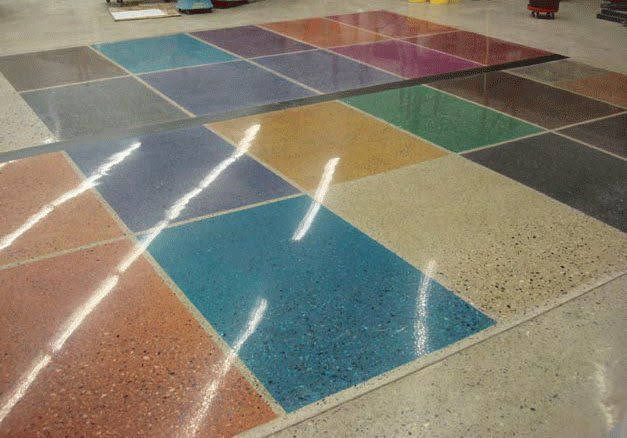 Colorful tiled floor, each tile a different hue, with glossy finish reflecting light.