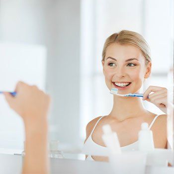 Cosmetic Dentistry — Brushing Teeth in Louisville, Kentucky Cosmetic Dentistry — Brushing Teeth in Louisville, Kentucky