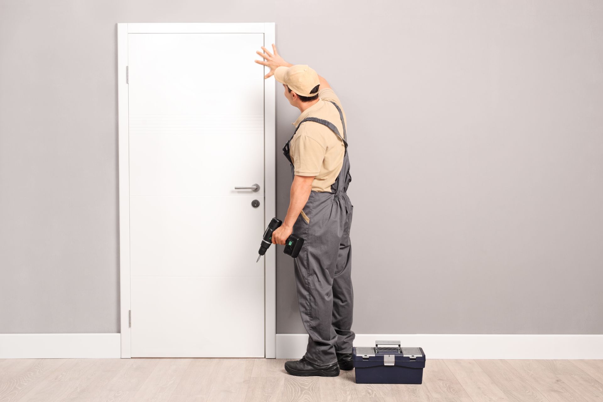 Contractor installing new door
