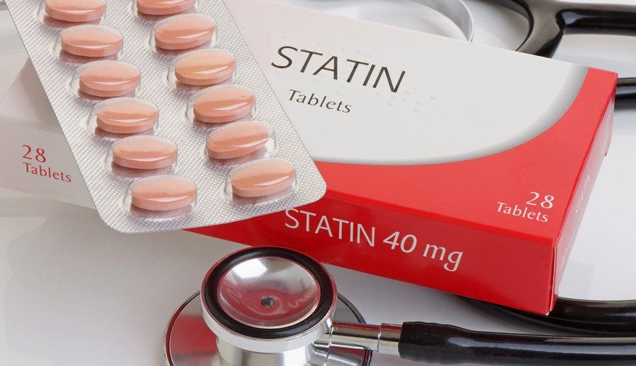 A box of statin 40 mg tablets next to a stethoscope