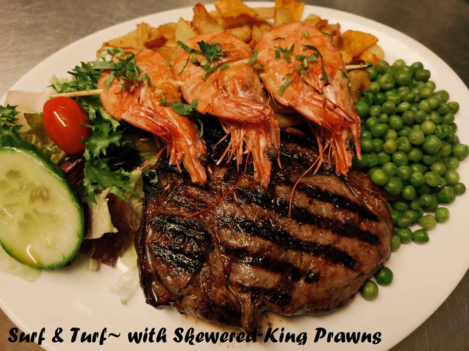 Charcoal Grilled Angus Ribeye Steak with Surf & Turf Skewered Tiger Prawn