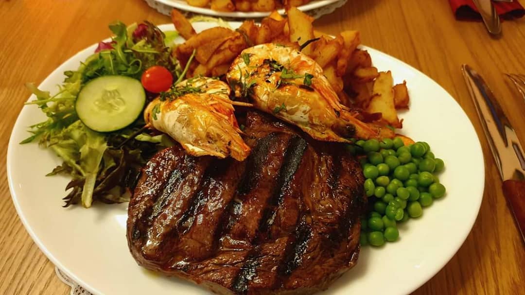 Steak topped with Shrimp