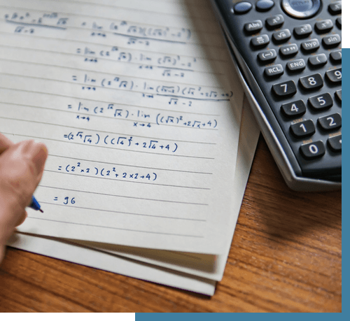 A left-handed person solving math problem