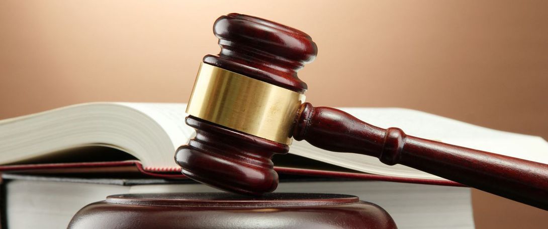 Gavel and law book used by solicitors in Canterbury  