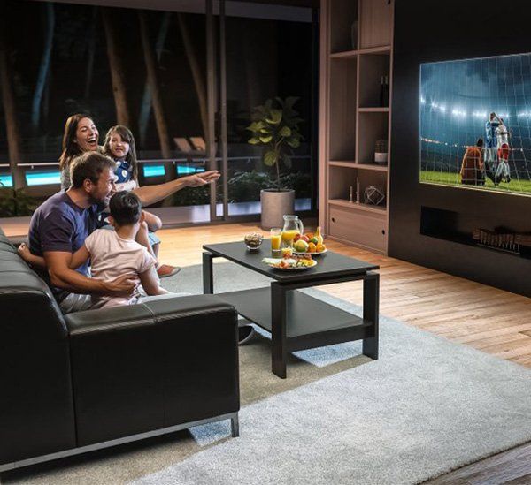 A Family Enjoying A New TV — Sonic Digital In West Gosford, NSW
