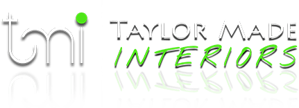 Taylor Made Interiors logo in gray and green with a glossy reflection effect