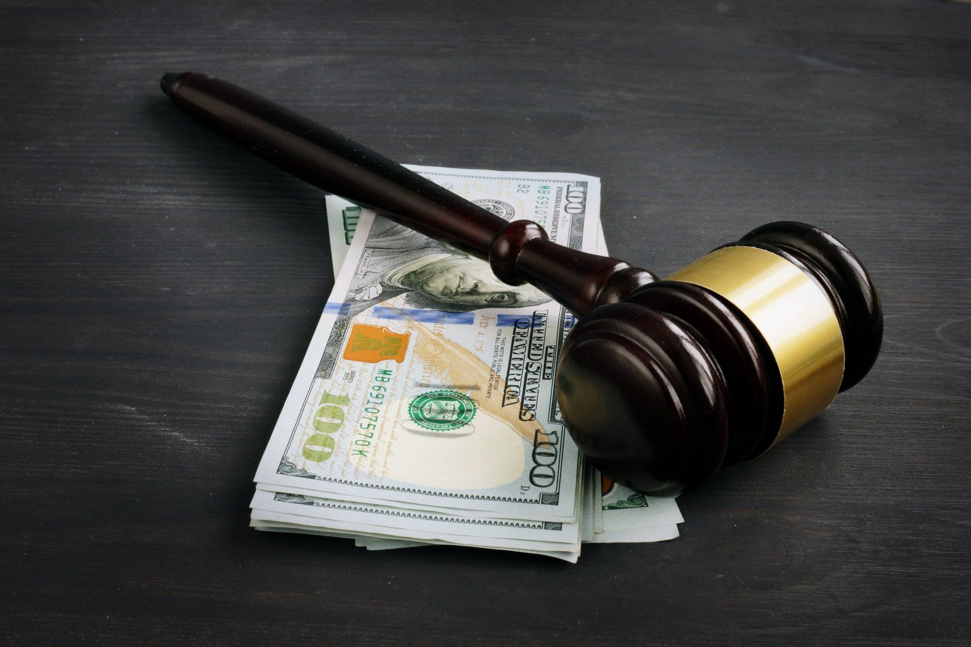 Gavel and Cash in Table l Charlotte, NC l U.S Bonding