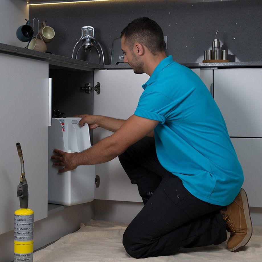 Man installing water softener