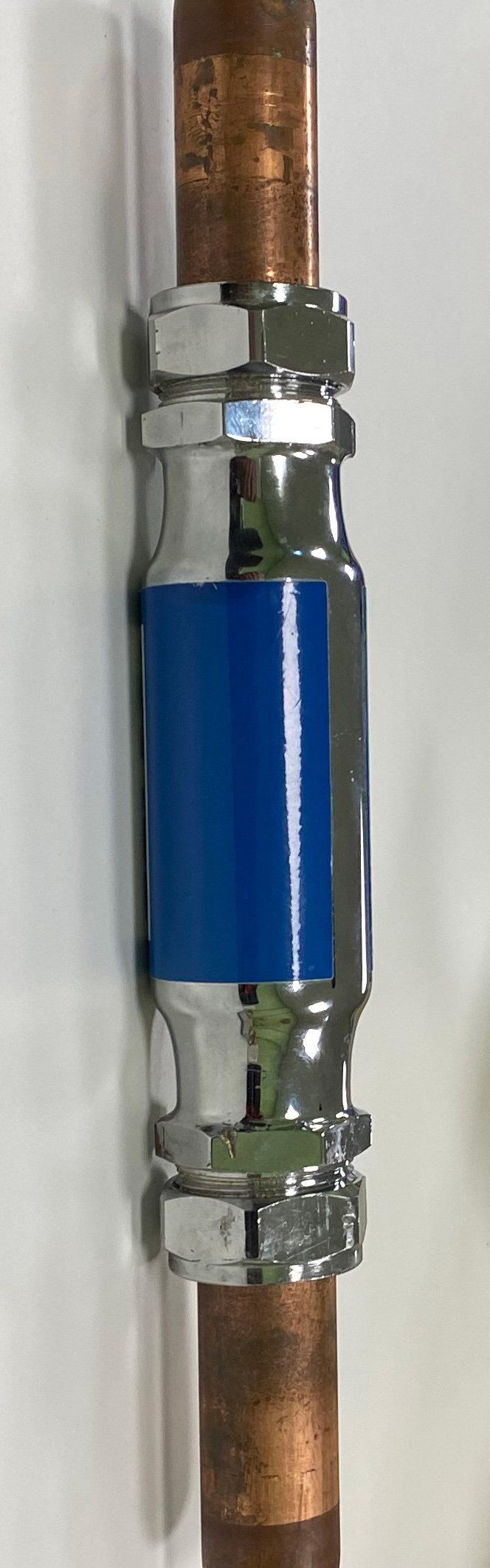 water conditioner attached to a pipe