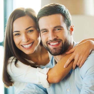 couple embracing and smiling