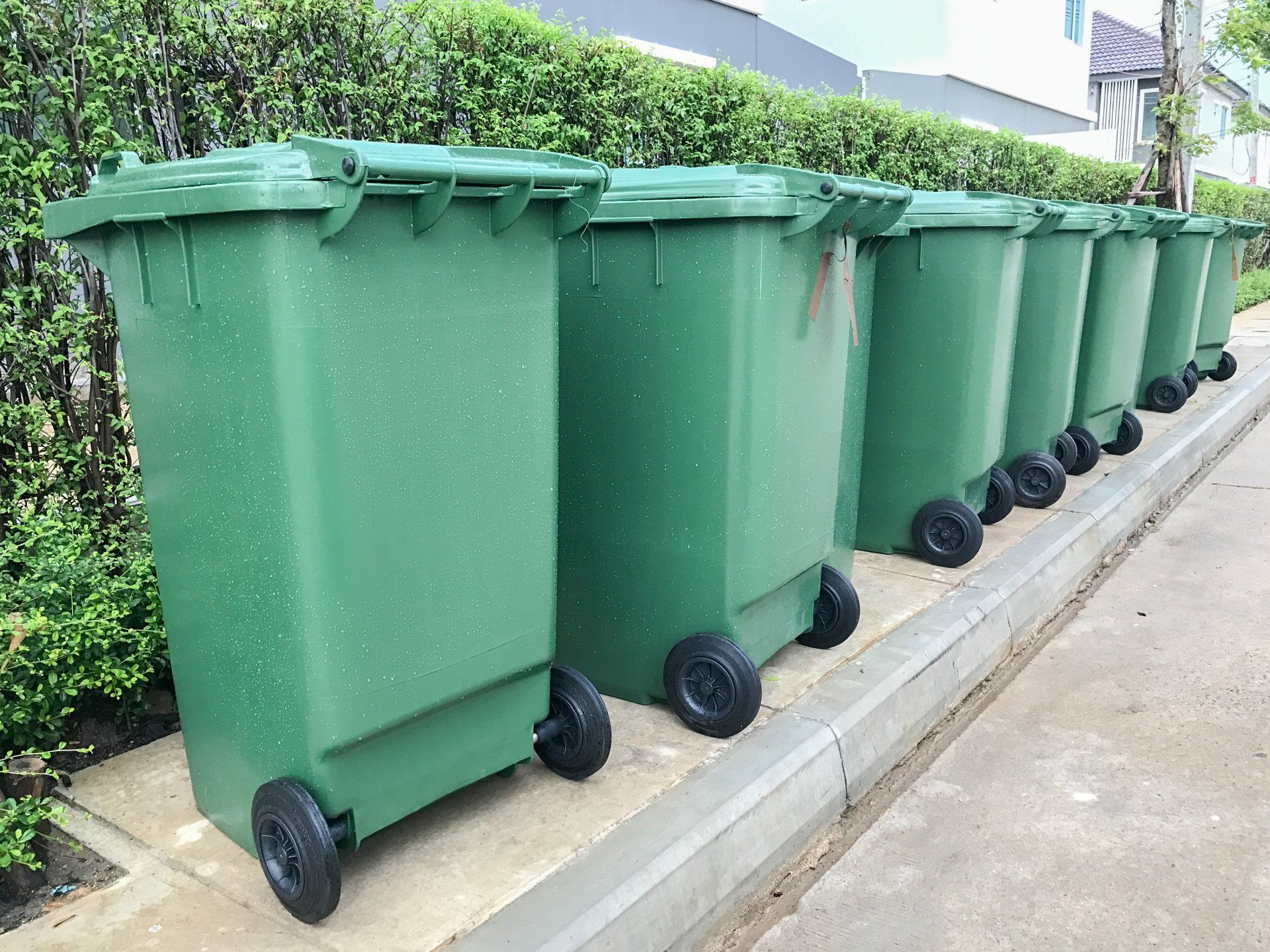 Line of Trash Cans — Jamestown, RI — Island Rubbish Services Line of Trash Cans — Jamestown, RI — Island Rubbish Services