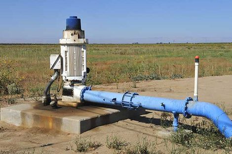 Water is pumped into irrigation canal Water is pumped into irrigation canal