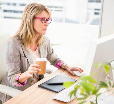 Female business owner about to Contact Solution Web Designs for a Free Consultation on Our Blog Writing Services