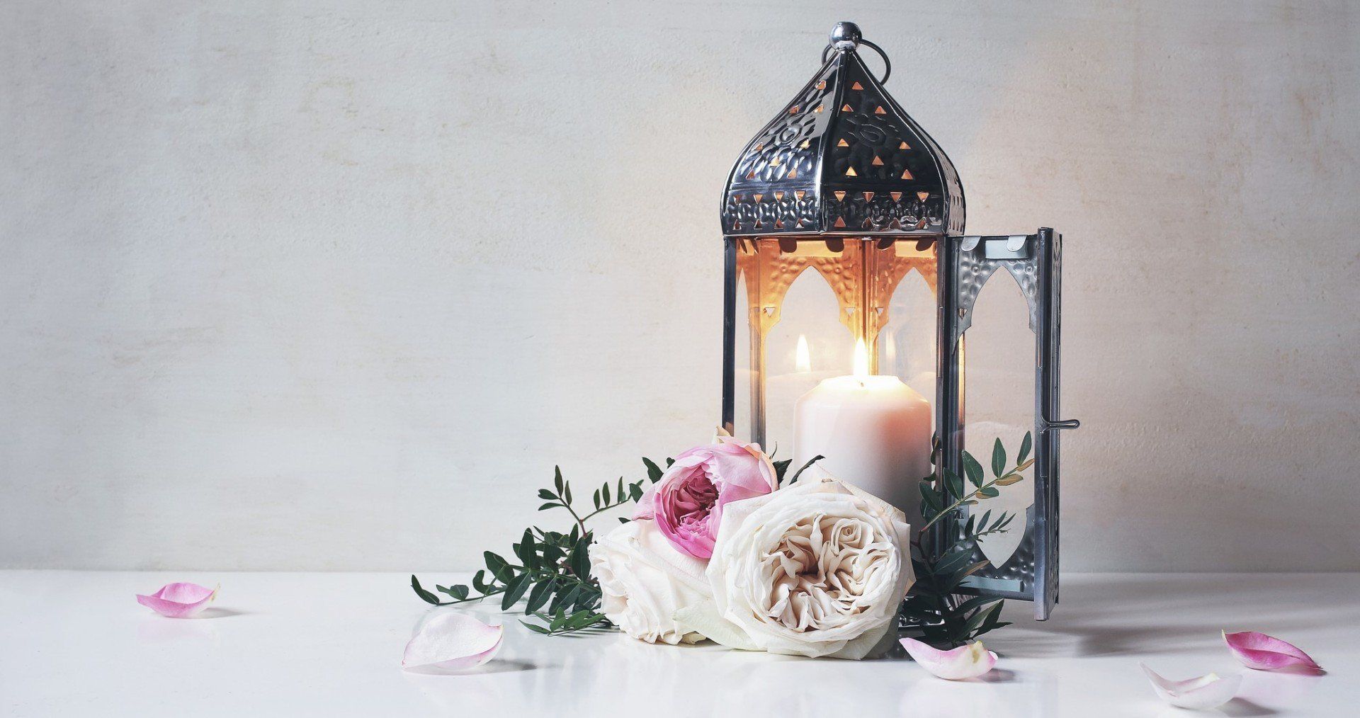 burial services candle lantern white pink flowers