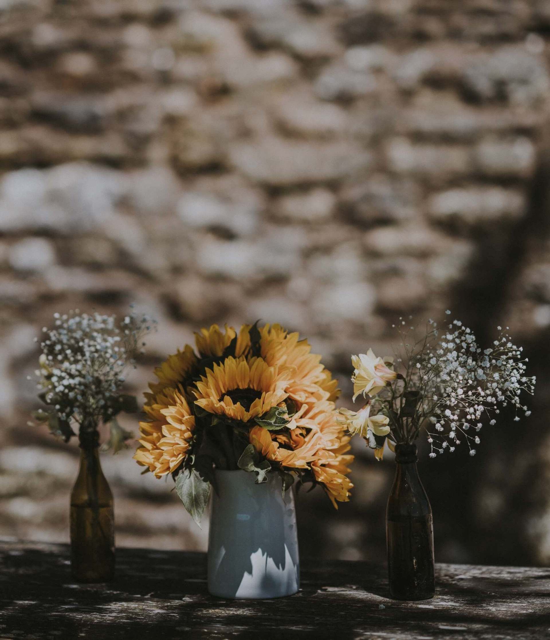 traditional funeral services flowers in vases on table