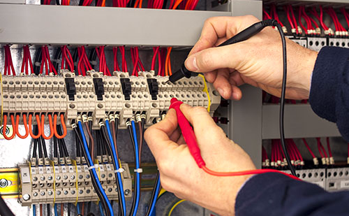 Professional doing electrical repair work