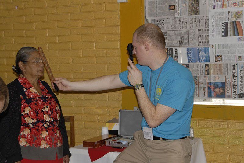 Dr. Mike Lyons giving eye exam