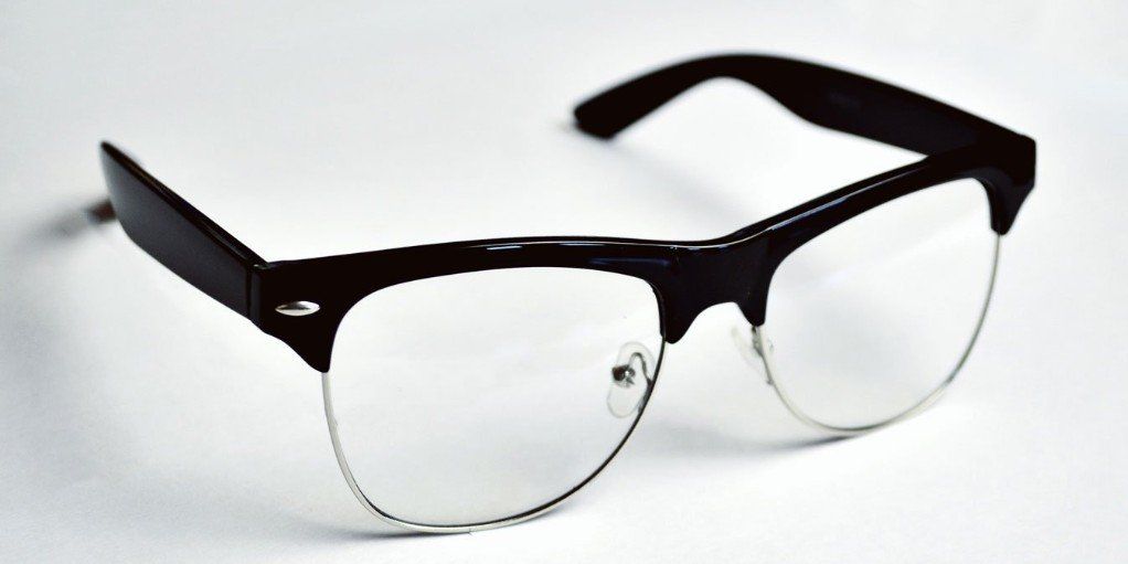 A pair of glasses with black frames and clear lenses