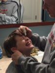 Dr. Lyons starting the vision reshaping process for 8 year old boy