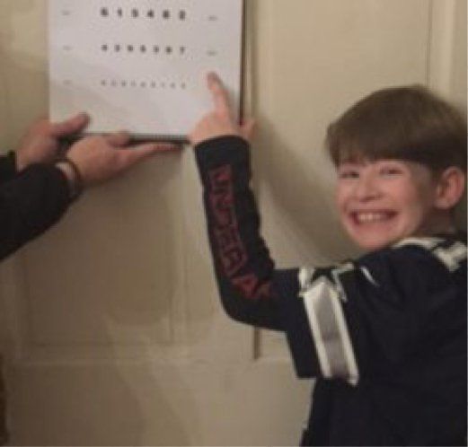 Diegan points to eye chart after 3 days of orthokeratology treatment