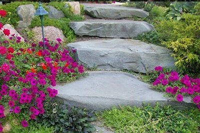 Beautiful Stone Stairway With Pink Flowers On Side — Landscaping in Shelby Township, MI Beautiful Stone Stairway With Pink Flowers On Side — Landscaping in Shelby Township, MI