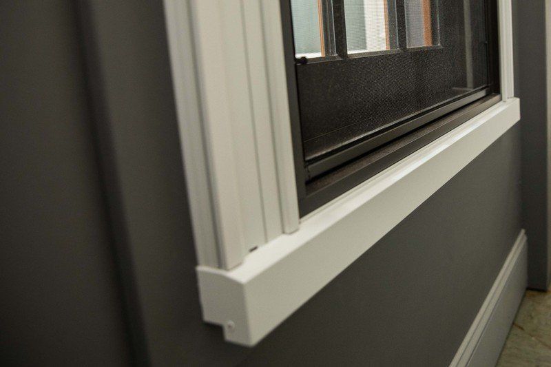 Home Windows — A White Window Frame in Farmingdale, NY