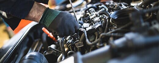 Person working with car — Automotive Repair in Kinston, NC Person working with car — Automotive Repair in Kinston, NC
