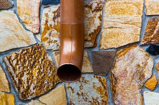 Siding Installation — Brick Siding of a House with Two Windows in Rye, NY Siding Installation — Brick Siding of a House with Two Windows in Rye, NY