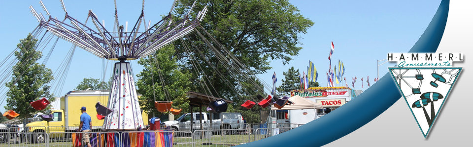A picture of a carnival ride with a logo that says usa wings