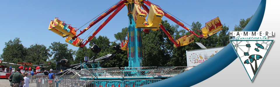 A carnival ride with the word ultimate on the bottom