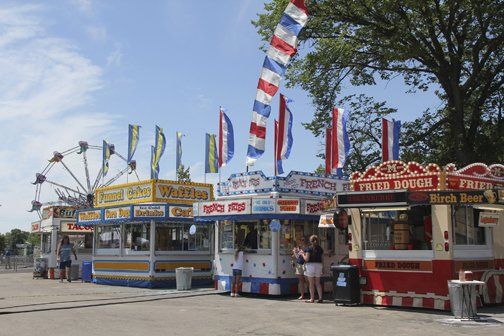 A row of food trucks including fried rough and birch beer
