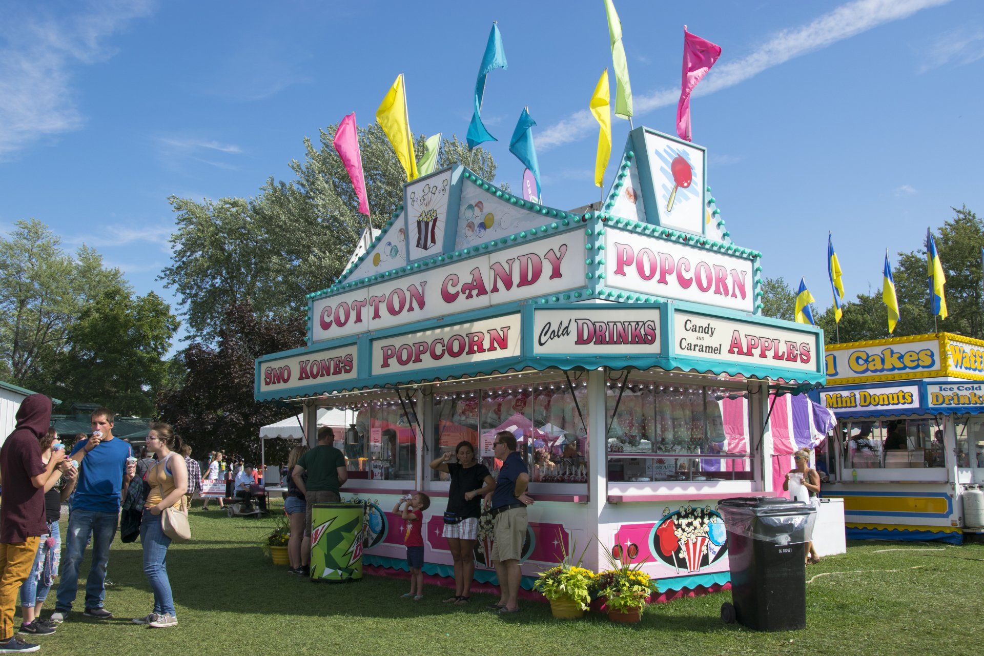 A cotton candy and popcorn stand at a carnival