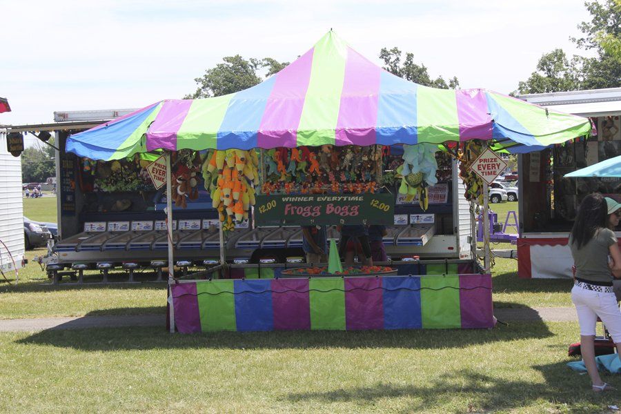 A colorful tent with the word frogs on it