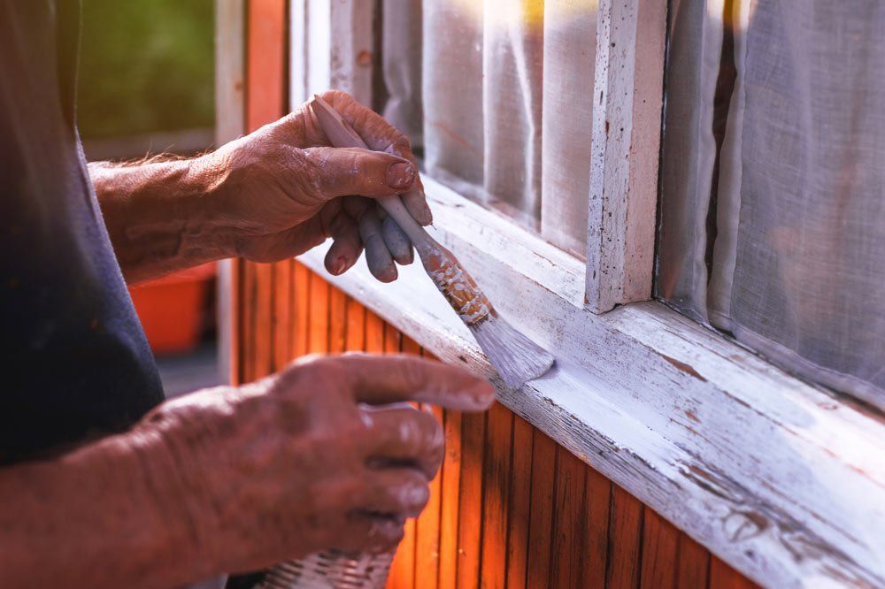 Worker Painting Window — Bolingbrook, IL — A & D Quality Painting