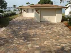 House with A Garage Door — Sarasota, FL — Custom Pavers of Southwest Florida