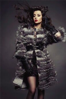 Woman wearing a dress made in fur Woman wearing a dress made in fur