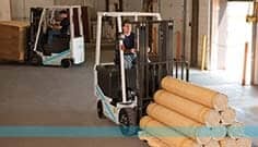Forklifts — Worker Driving A Platinum BX 4-Wheel Forklift In Manorville, NY