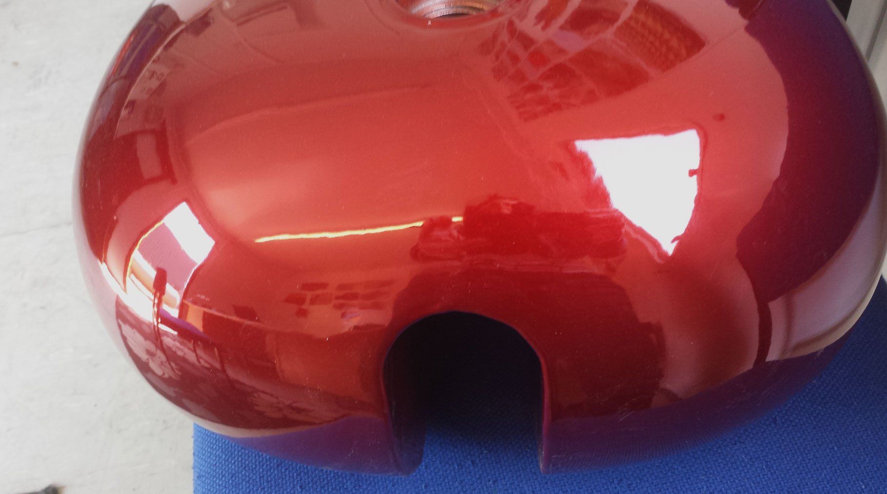 Reflective surface of red candy lacquer