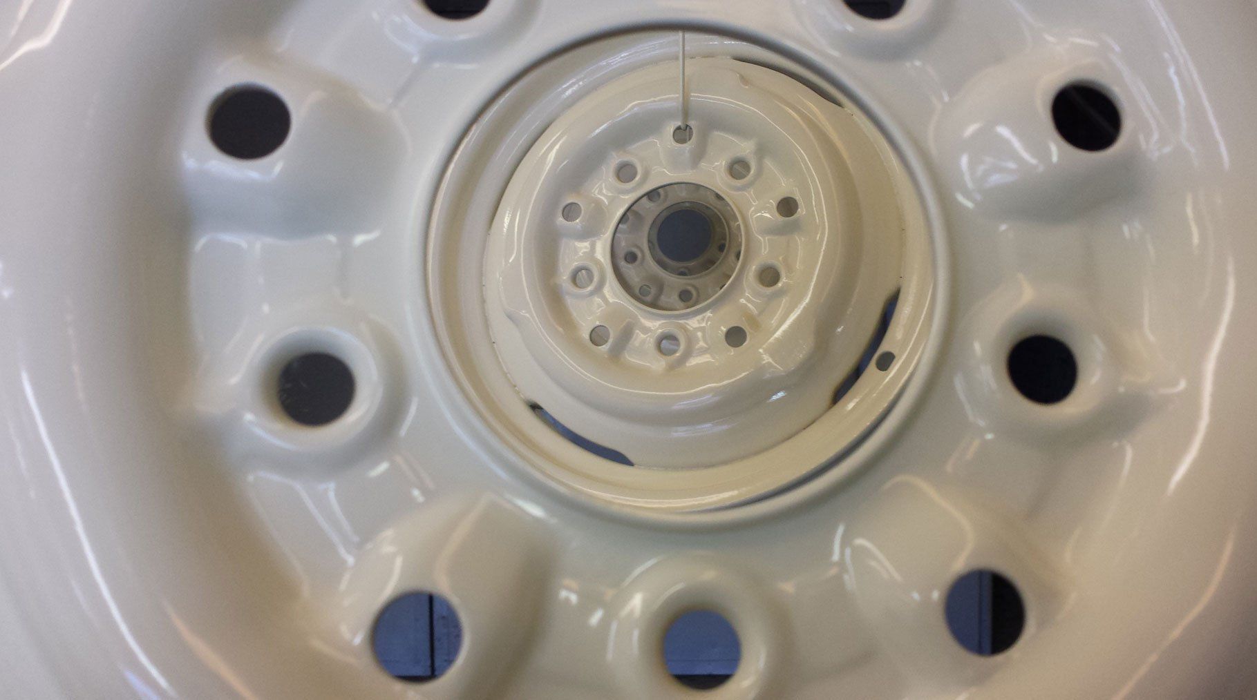 Wheels powder coated in white.
