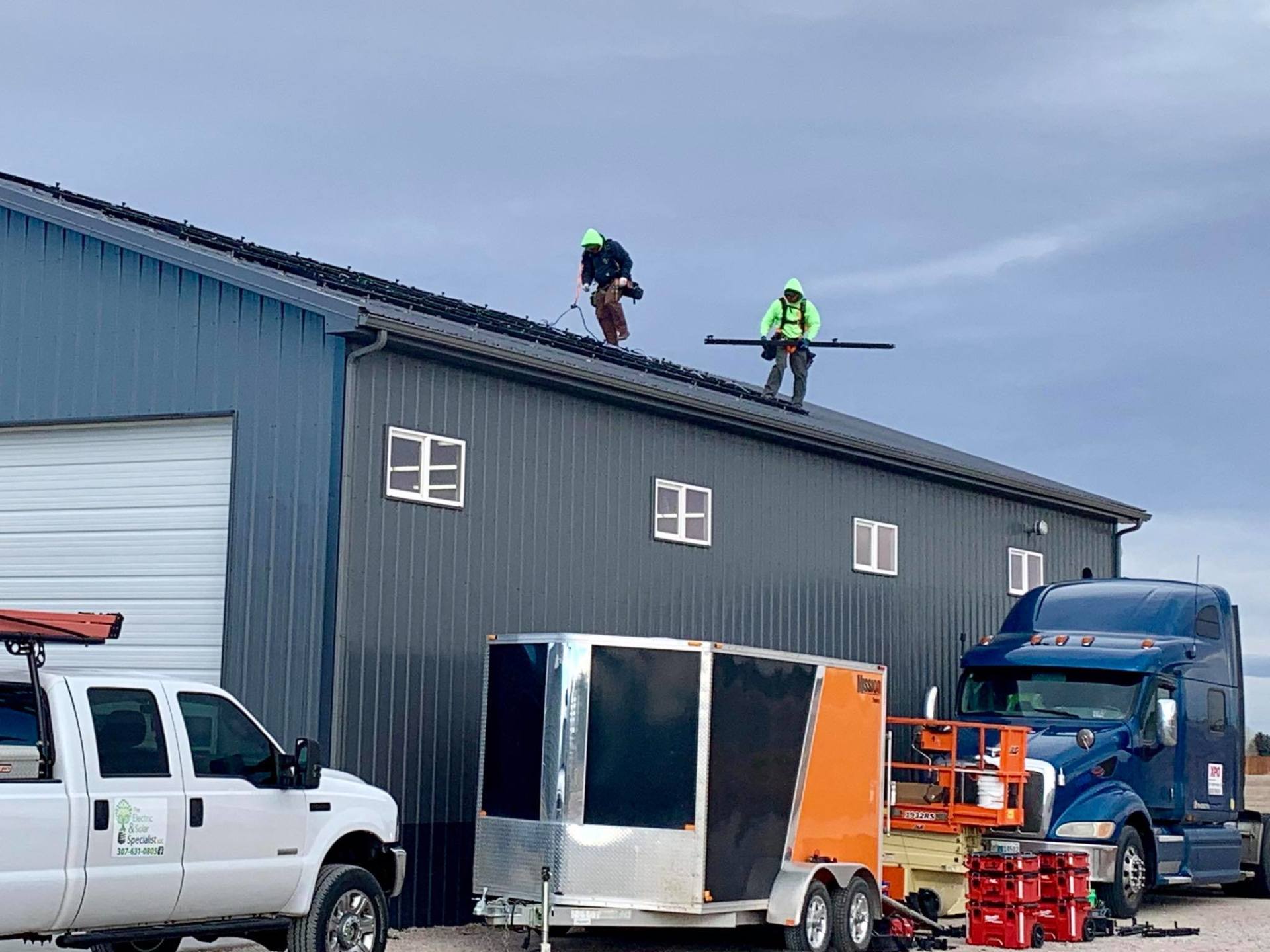 Men Installing Solar Panel — Cheyenne, WY — The Electric & Solar Specialist
