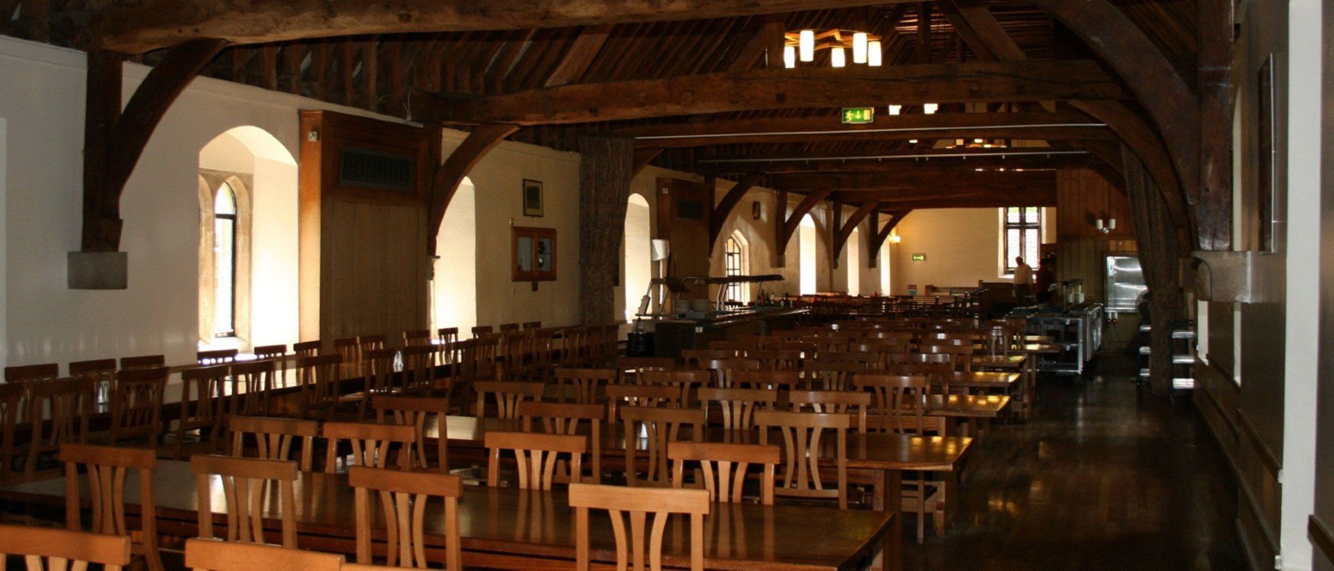 wooden chairs and tables in a a commercial area