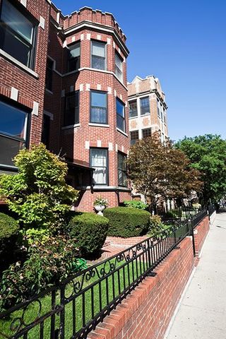 The front of a brick house in Chicago, IL.
