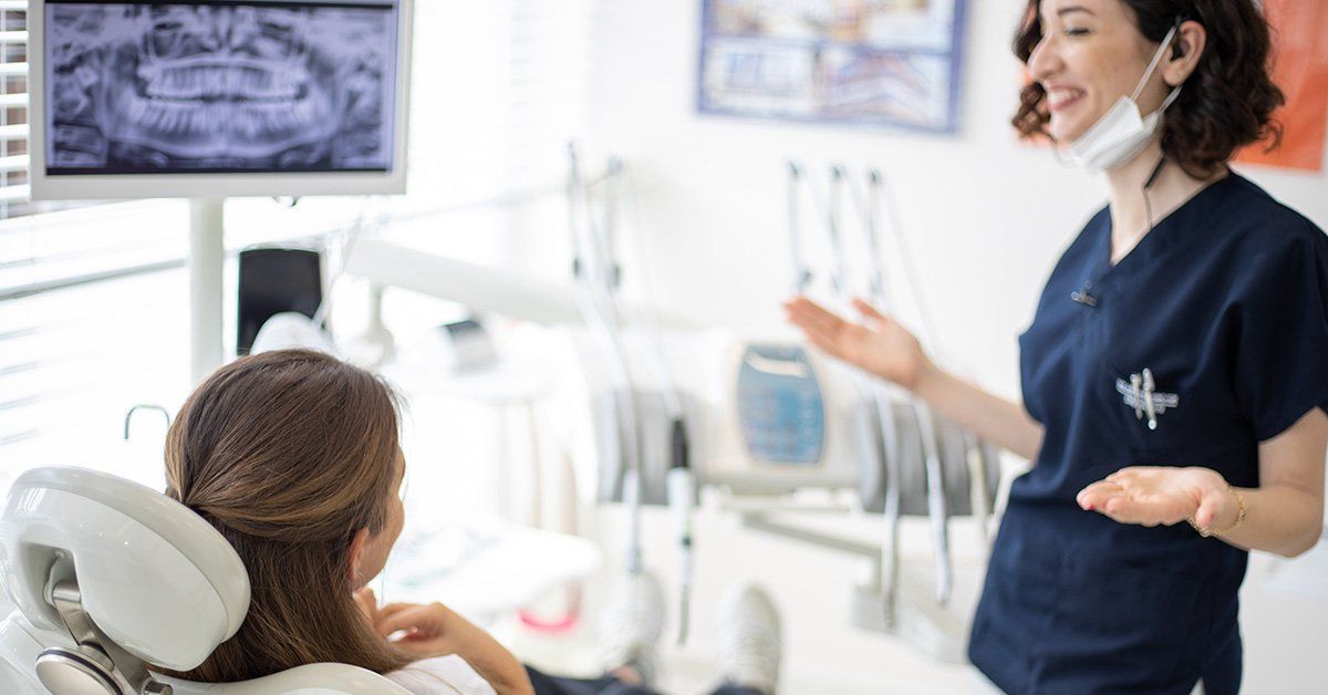 dentist assisting woman