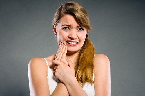 TmJ and TMD Dentistry Young lady having tooth pain