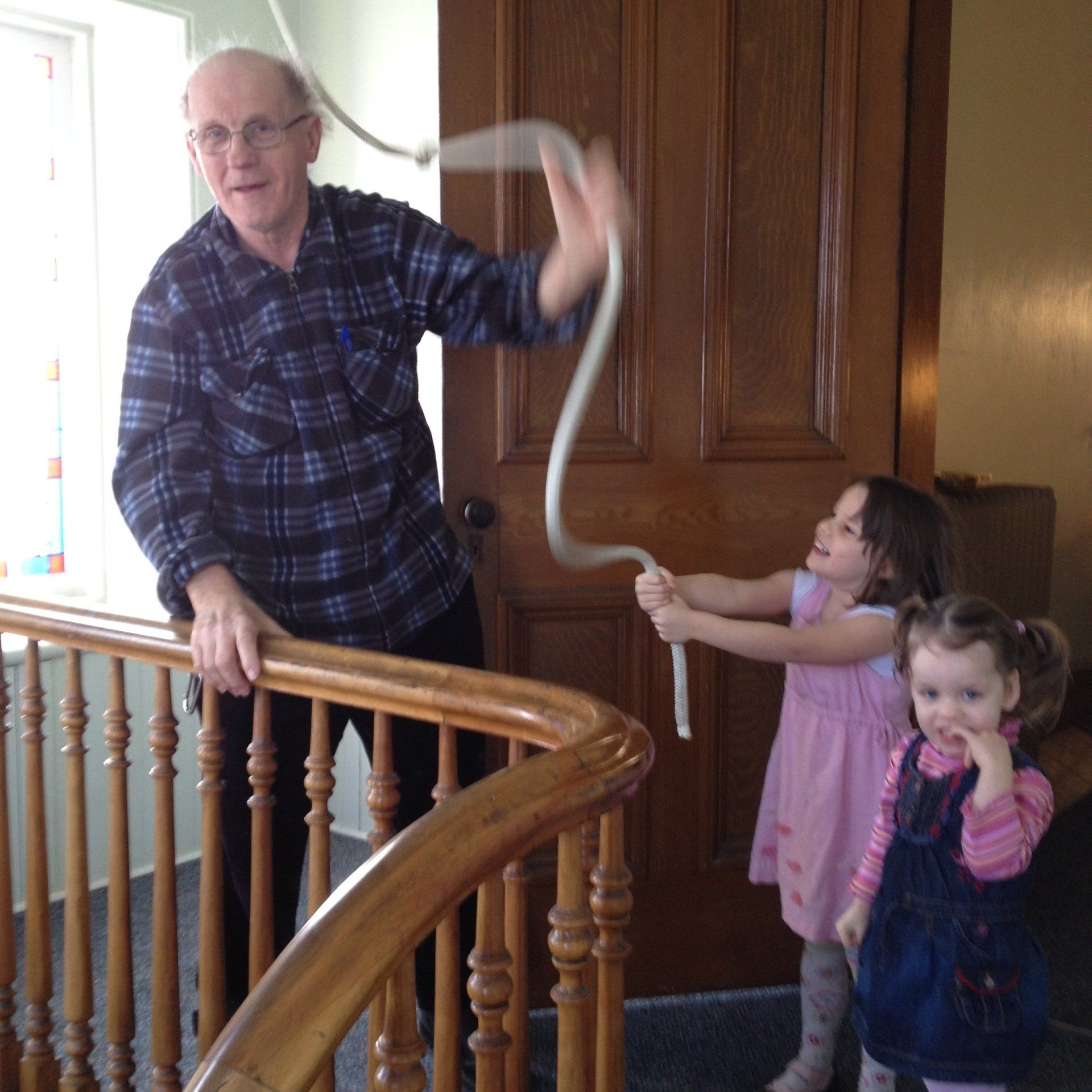 Helping to ring the bell at worship