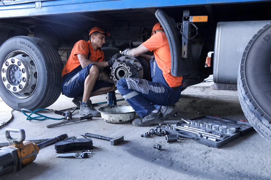 Two Mechanic Repairing Truck Brakes — Automotive Repair in Townsville Two Mechanic Repairing Truck Brakes — Automotive Repair in Townsville
