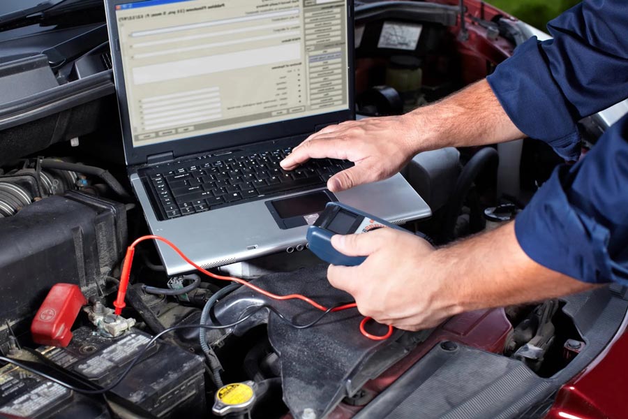 Mechanic Check Engine Using Laptop — Automotive Repair in Townsville Mechanic Check Engine Using Laptop — Automotive Repair in Townsville
