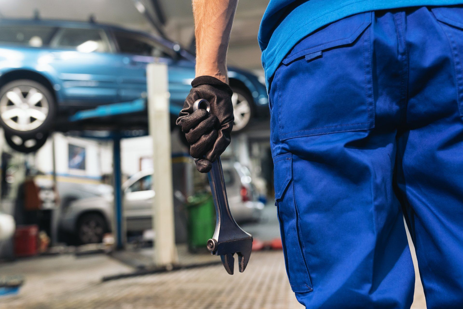Mechanic Holding Wrench Tool — Automotive Repair in Townsville Mechanic Holding Wrench Tool — Automotive Repair in Townsville