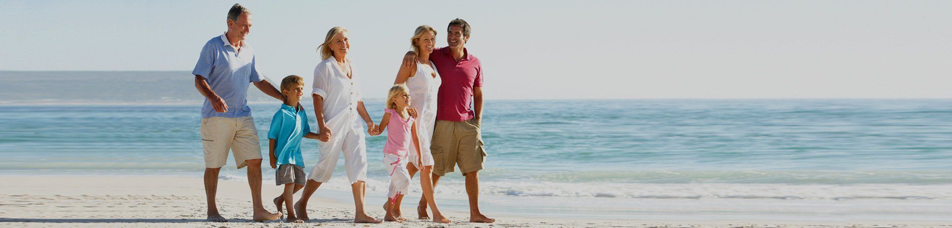 family walking on the beach