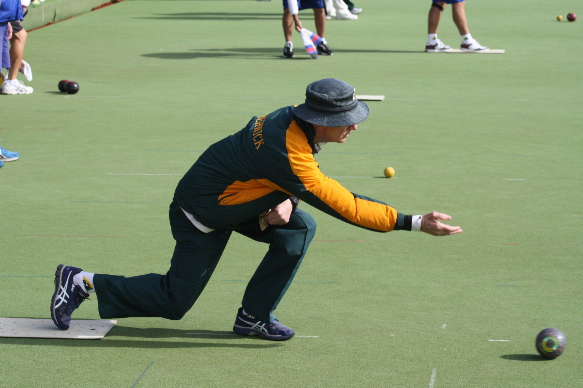 Bowler delivering a bowl on the green